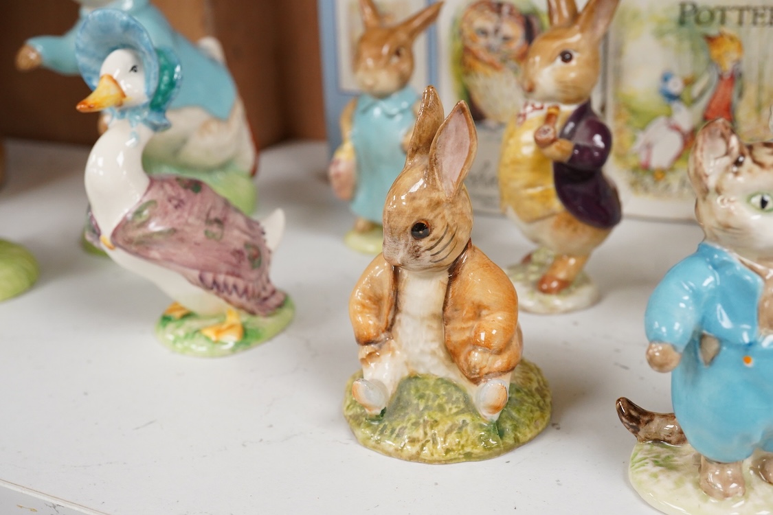Nine Beswick Beatrix Potter figures, some stamped F. Warne & Co , largest 17cm high